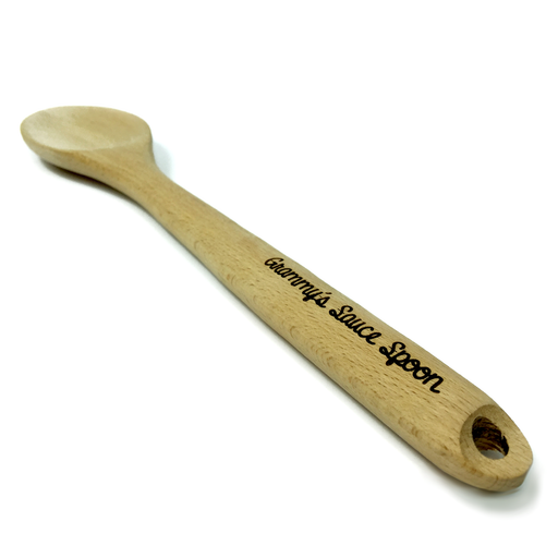 Laser engraved wooden spoon that says Grammys Sauce Spoon on handle against white background