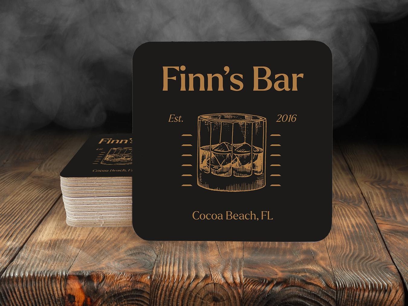 a coaster with a picture of a drink in a glass