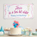 Personalized celebration banner displayed with cake and party decorations.