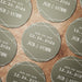 Personalized Save the Date coasters shown in multiple colors. Modern geometric wedding favors customized with names and date.