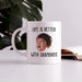 Custom photo mug for grandparents displayed on a table with “Life Is Better With Grandkids” design.