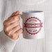 Custom Grandma mug held in hand featuring a personalized Certified Grandma established year design.
