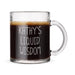 A glass mug filled with a dark liquid, likely coffee or tea, with foam on top. The mug has the text "Kathy's Liquid Wisdom" engraved on it in white lettering.