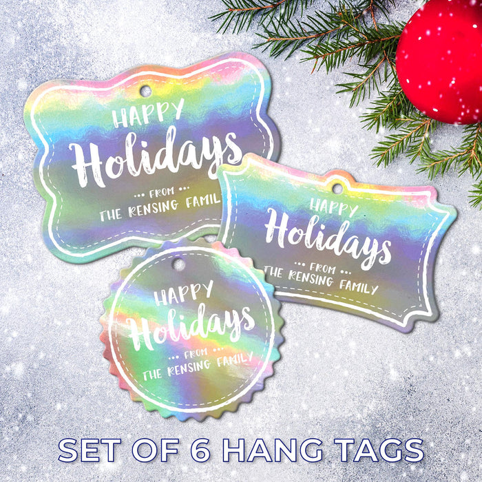 Set of 6 personalized Happy Holidays gift tags in three shapes displayed on a snowy holiday background with evergreen branches and a red ornament.