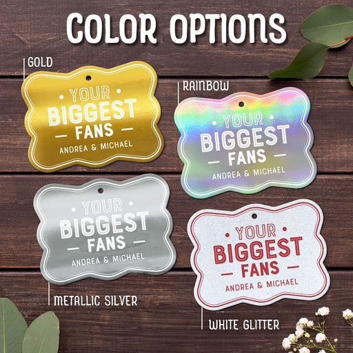 Close-up of the “Your Biggest Fans” wedding gift tag design available in Gold, Rainbow, Metallic Silver, and White Glitter foil finishes. The personalized tags feature custom sender names and bold typography.