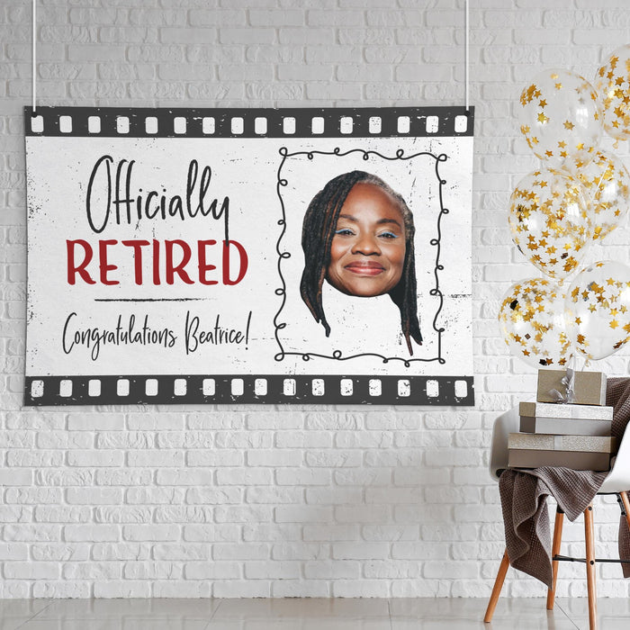 Officially Retired banner displayed as party décor in a modern event setting. Personalized with a custom photo and retiree name for a memorable retirement celebration.