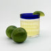 Blue rim margarita glass with “Margaritas Pair Well With Motherhood” UV etched design and fresh limes.