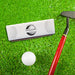 Golf-themed wedding gift box displayed on a putting green with a golf club and golf ball. Personalized for a golf-loving bride and groom.