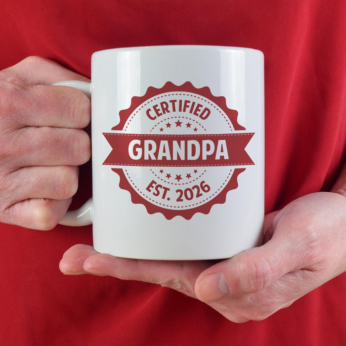 Custom Grandpa mug held in hand with Certified Grandpa and established year design.