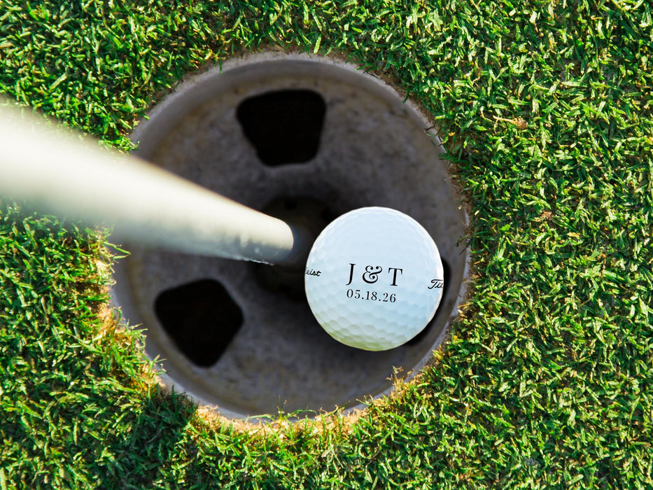 Titleist golf ball shown in a golf course hole.