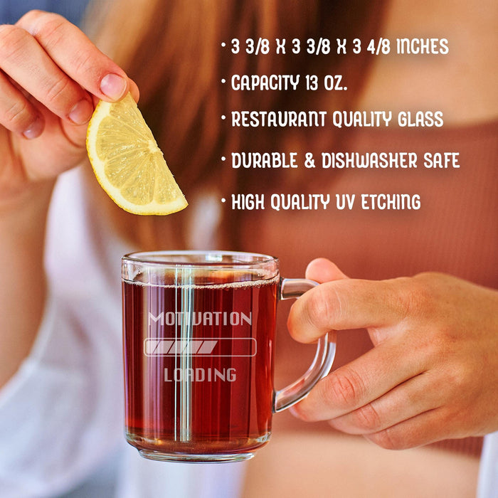 A person is holding a glass mug with a message engraved on it. The image is accompanied by a text overlay that reads • 3 3/8 x 3 3/8 x 3 4/8 inches • Capacity 13 oz. • restaurant quality glass • durable & dishwasher safe • high quality uv etching