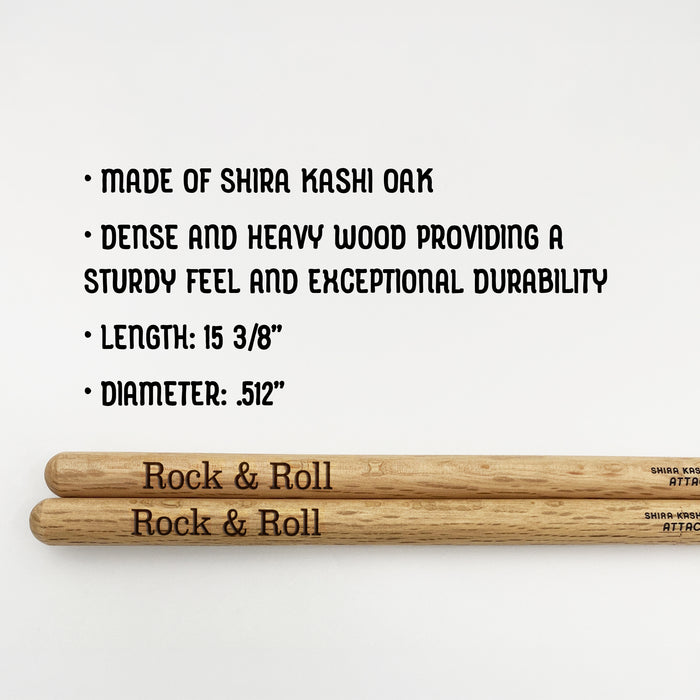 a pair of Shira Kashi oak drumsticks, with text providing information about the material and dimensions.