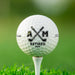 Personalized retirement golf ball featuring the Retired Monogram design with custom initials and retirement year. Displayed on a golf tee against a golf course background.