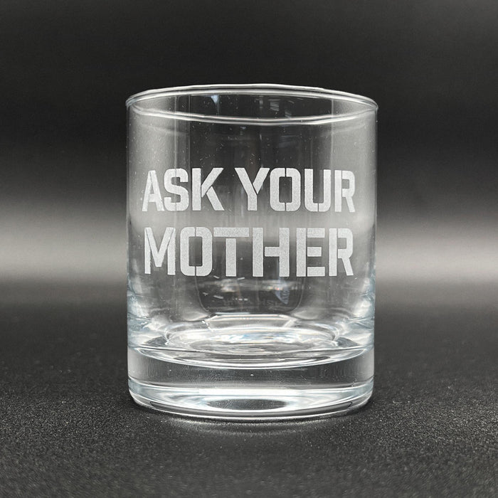 Close-up image of an empty whiskey glass with the engraved phrase visible. This view highlights the clean etching and overall glass quality.