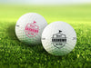 Two golf balls with the text "BEST GRANDMA BY PAR" printed on them, placed on a grassy field.
