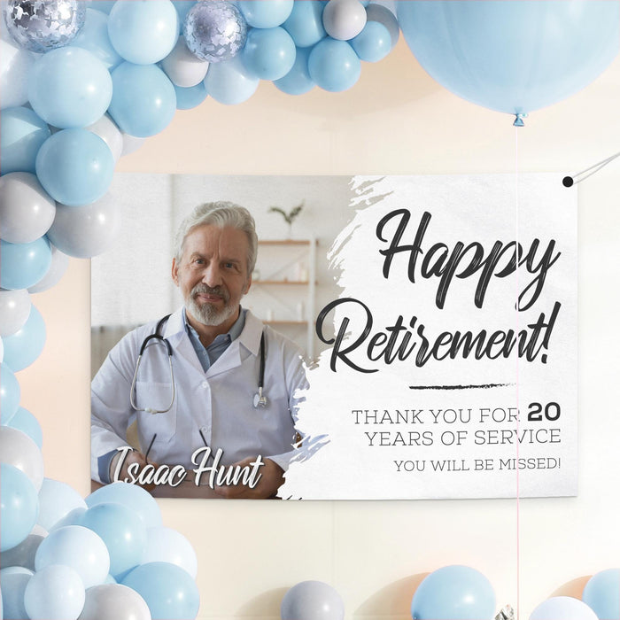 Happy Retirement banner displayed as a party backdrop surrounded by blue balloons. Personalized retirement decoration featuring a custom photo and years of service.
