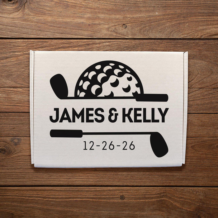 Wedding gift box featuring a golf-themed design with custom names and wedding date. Displayed on a wood background to showcase the personalized artwork.