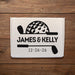 Wedding gift box featuring a golf-themed design with custom names and wedding date. Displayed on a wood background to showcase the personalized artwork.