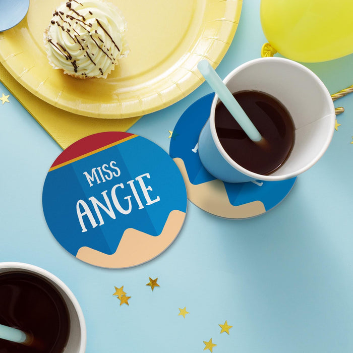 Lifestyle image of teacher coasters with drinks and snacks on a table. Shows everyday use for coffee or tea.