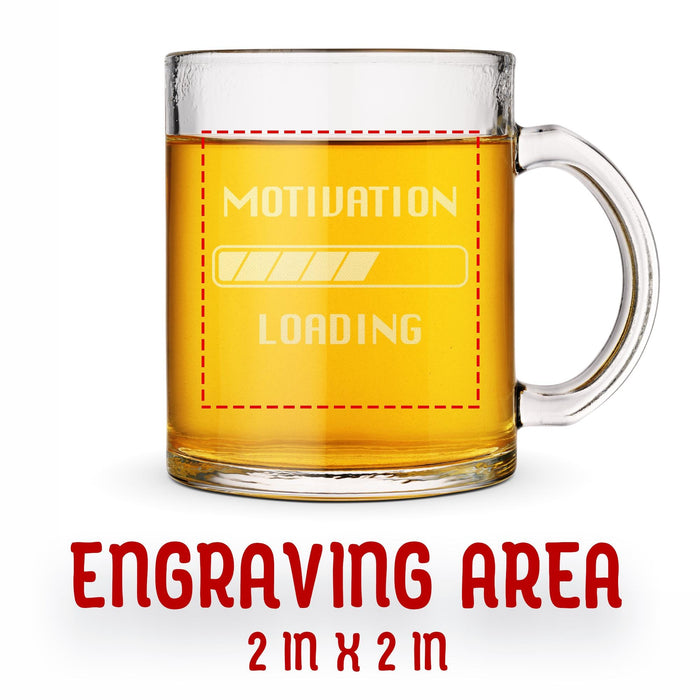 A glass mug with an engraved design on it. The mug is filled with tea, and there is text under the mug that reads "Engraving Area is 2 in x 2 in”