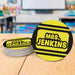 Personalized teacher coasters displayed in a classroom setting. Demonstrates real-life teacher desk use.