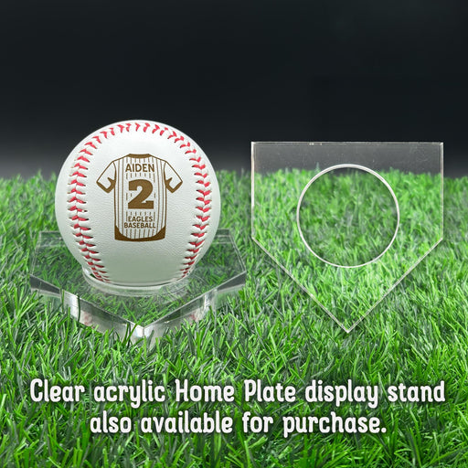 A personalized baseball with red stitching is placed on a clear acrylic stand, accompanied by a text overlay that reads Clear acrylic Home Plate display stand also available for purchase.