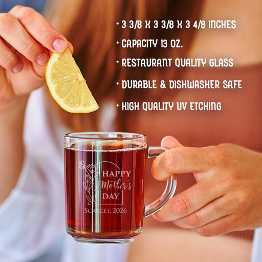 A person is holding a glass mug with a message engraved on it. The image is accompanied by a text overlay that reads • 3 3/8 x 3 3/8 x 3 4/8 inches • Capacity 13 oz. • restaurant quality glass • durable & dishwasher safe • high quality uv etching