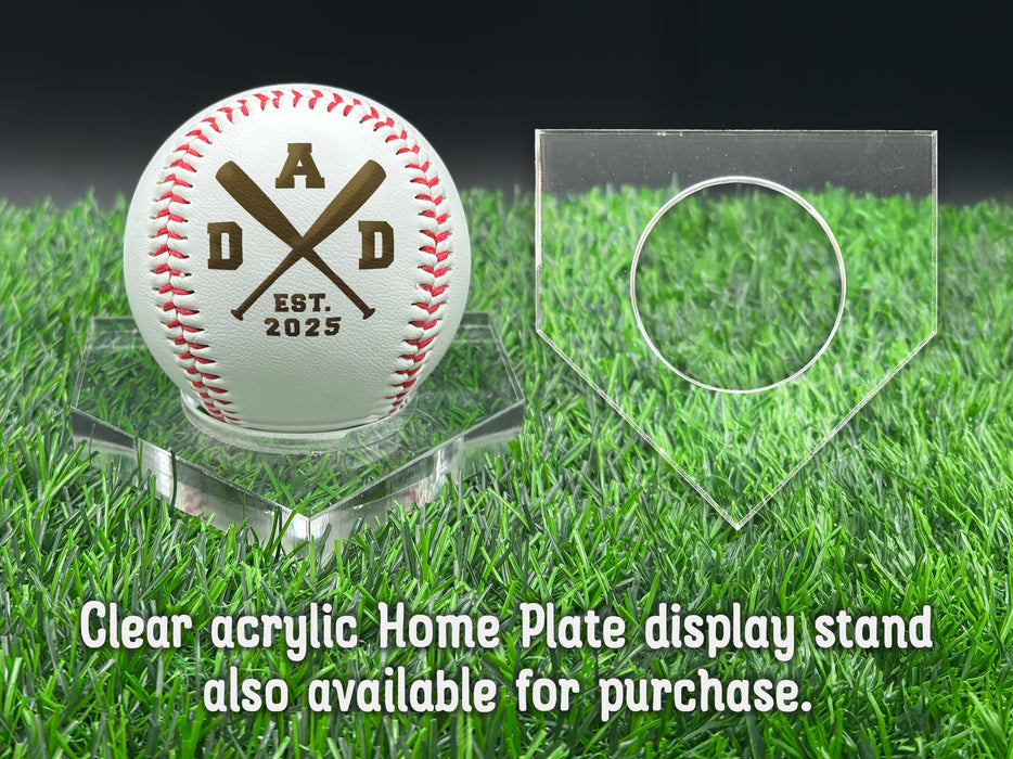 A personalized baseball with red stitching is placed on a clear acrylic stand, accompanied by a text overlay that reads Clear acrylic Home Plate display stand also available for purchase.