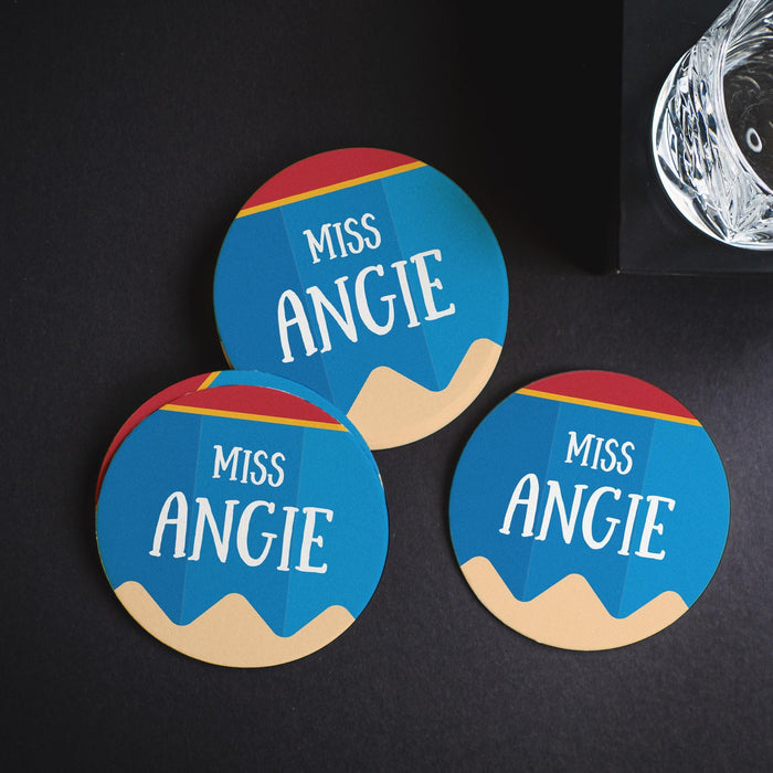 Multiple personalized pencil coasters arranged on a dark background. Showcases design variation and visual contrast.
