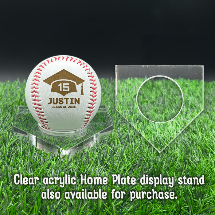 A personalized baseball with red stitching is placed on a clear acrylic stand, accompanied by a text overlay that reads Clear acrylic Home Plate display stand also available for purchase.