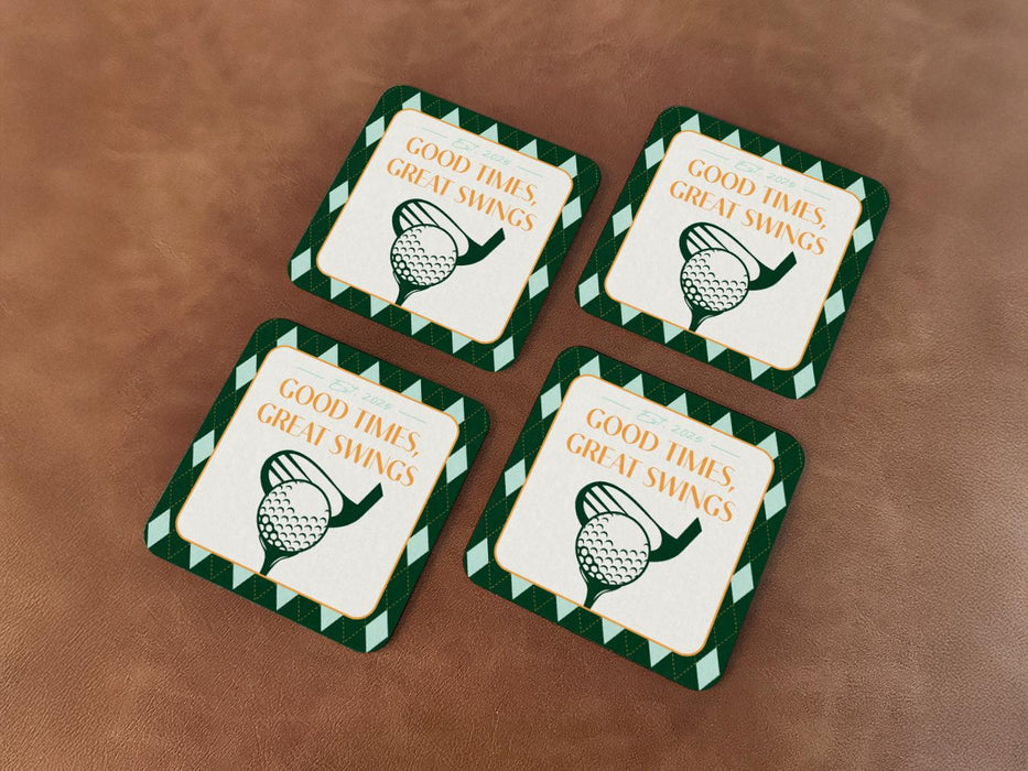 Custom square pulpboard coasters are shown sitting on leather surface. The coaster features design with an illustration of a golf ball and with club behind it, argyle background pattern, and custom text.