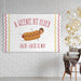 Personalized "A Weenie Bit Older" birthday banner displayed as wall décor on a white brick wall.