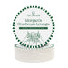 A round coaster with text and illustrations related to a golf club lounge in Emerald Green.