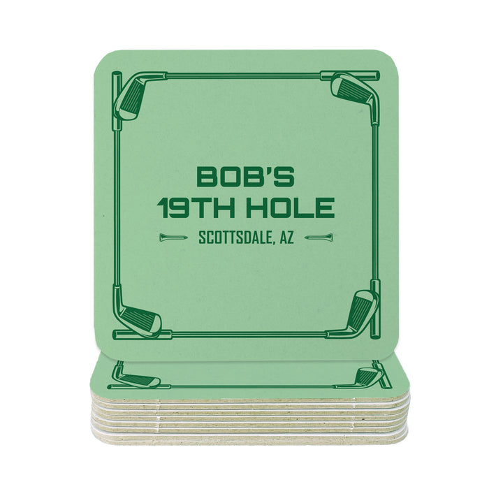 A stack of green square coasters with the text "BOB'S 19TH HOLE SCOTTSDALE, AZ" printed on them.