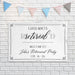 Guess Who's Retired retirement banner displayed on a white brick wall. Sophisticated retirement party décor featuring custom name and event date personalization.