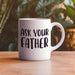 “Ask Your Father” mug displayed outdoors on a warm wooden table with soft greenery in the background. A relaxed lifestyle mockup perfect for Father’s Day gifting.
