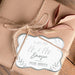 Personalized “Mr. & Mrs.” wedding gift tag attached to kraft paper wrapping using natural twine. The metallic foil finish and decorative leaf border create an elegant keepsake-style look.