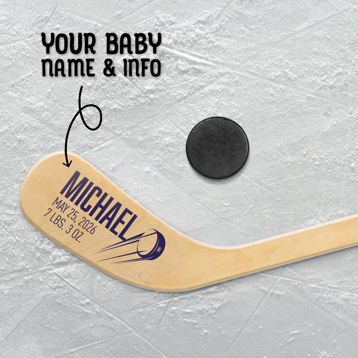 Close-up of the blade featuring baby name “Michael” in large bold lettering with birth date and weight underneath, accented by a hockey puck graphic.