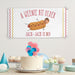 Personalized "A Weenie Bit Older" birthday banner displayed with cake and party decorations.