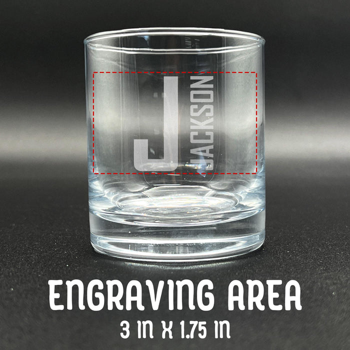 Close-up image of an empty whiskey glass with the engraving area marked at 3 inches by 1.75 inches. Helps customers understand design placement and sizing.