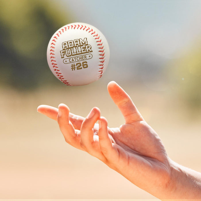 A baseball is being thrown into the air by a person's hand.