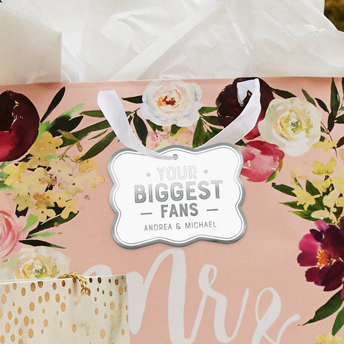 Silver wrapped gifts featuring personalized “Your Biggest Fans” foil wedding gift tags. Elegant gift presentation idea for weddings, bridal showers, and engagement parties.