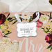 Silver wrapped gifts featuring personalized “Your Biggest Fans” foil wedding gift tags. Elegant gift presentation idea for weddings, bridal showers, and engagement parties.