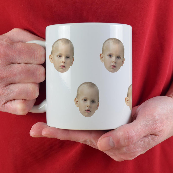 Personalized grandkids photo mug held against a red shirt.