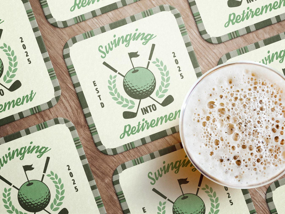 Custom square pulpboard coasters are shown laid out on a wooden surface. A beer mug is shown on top of a few of the coasters. The coaster features design with illustrated golf ball, club, and flag on top with wreath surrounding it, argyle background pattern, and custom text.
