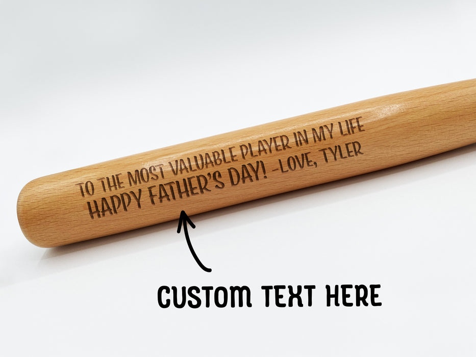 a mini wooden baseball bat with a Father's Day message from Tyler on it | text says "Custom Text Here"
