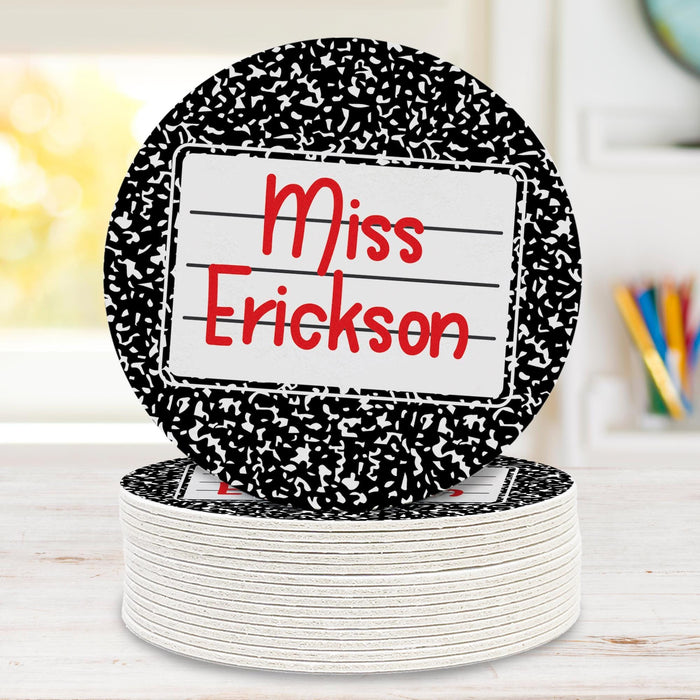 Stack of personalized coasters with one standing upright. Highlights thickness and layered construction.