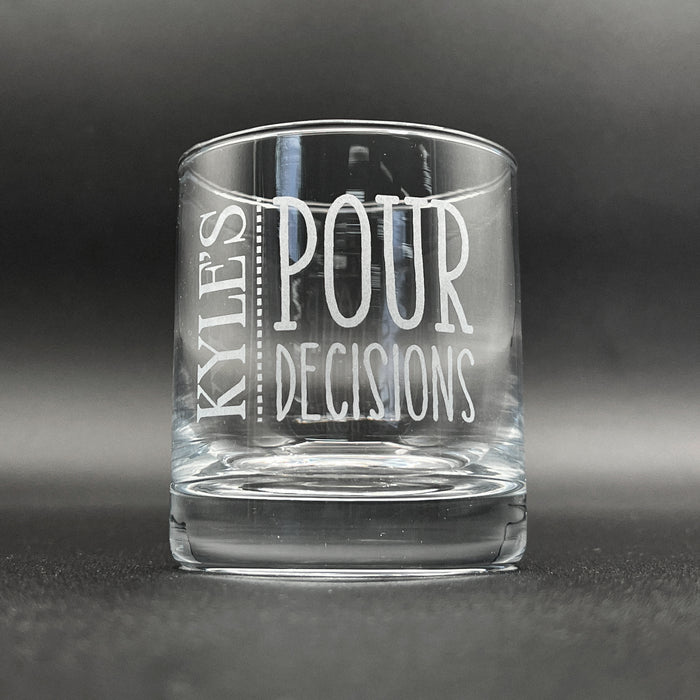 A clear glass with the text "POUR DECISIONS" printed on it.