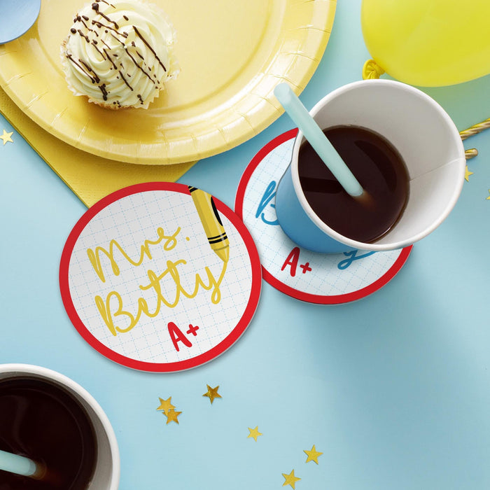 Lifestyle image of teacher coasters with drinks and snacks on a table. Shows everyday use for coffee or tea.