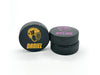 three stacked hockey pucks with printed name & number helmet designs in the color yellow and purple with the names Daniel an Dylan